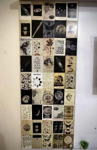 a wall with a collage of pictures on it at Calm Corner in Panchkula