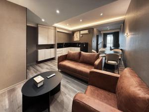a living room with a couch and a table at Tropics Eight Suites in George Town