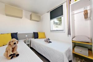 Postel nebo postele na pokoji v ubytování Giannella Camping