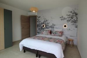 a bedroom with two beds and a wall mural at Villa d exception piscine privée 200m2 10 pers RESTONICA Les Terrasses de Ruppione in Pietrosella +27 photos