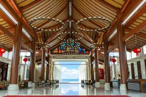a large building with a large wooden ceiling and a stained glass window at NDC Resort & Spa in Manado
