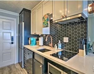 a kitchen with a sink and a counter top at Beachfront 8th floor Studio - Stunning View in Galveston