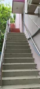 a set of stairs leading up to a building at Aiswarya illam in Chidambaram