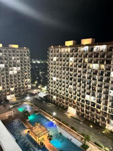 a view of two large buildings at night at Pinili Homestay in Suba