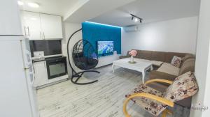 a living room with a couch and a table at Villa UpTown in Mostar