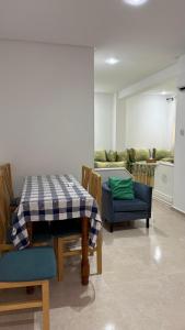 a dining room with a table and some chairs at Ventana al mar in Tangier