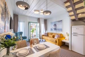 a living room with a table and a couch at 45House in Nafplio