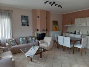 a living room with a couch and a table at Villa Rodia in Potos