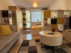 a living room with a couch and a table at Apartment city centrum in Nitra