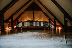 a bed in the middle of a attic at Boutique 11 Postavarului by Kronstay in Braşov