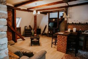 a living room with a couch and a table at Boutique 11 Postavarului by Kronstay in Braşov