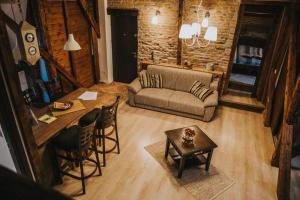 a living room with a couch and a table at Boutique 11 Postavarului by Kronstay in Braşov