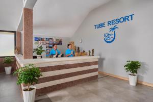 two people standing at a counter in a restaurant at Tube Resort by EHM in Koh Rong Sanloem +99 photos