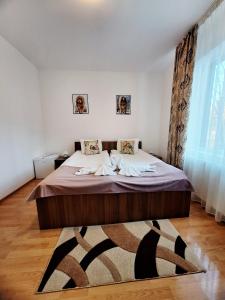 a bedroom with a large bed in a room at Thor și Cora in Sovata +45 photos