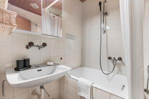 a white bathroom with a sink and a shower at Rustico Stock with free wifi- Happy Rentals in Lugano +26 photos