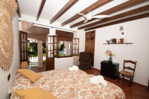 a bedroom with a large bed in a room at Casa Teones con piscina privada in Montecorto +70 photos
