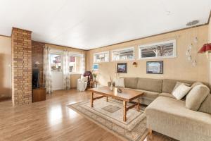 a living room with a couch and a table at Reine Panorama in Reine