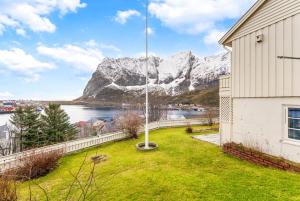 a house with a view of a mountain at Reine Panorama in Reine