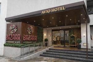 aania hotel entrance with stairs in front of a building at Avio Hotel in Chandigarh Airport