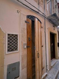 an entrance to a building with a wooden door at Old Town in Castellana Grotte