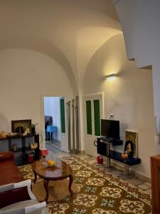 a living room with a couch and a table at Old Town in Castellana Grotte