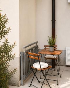 a wooden table and chairs on a patio at Sealavie in Koper