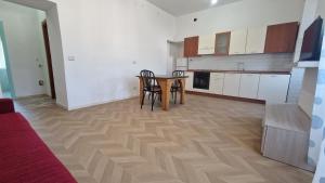 a kitchen with a table and chairs in a room at Via del Mare in Termoli