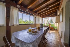 a table in a room with a table cloth and fruit on it at Casa Familiar Etxabe-Enea in Lasarte