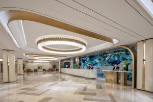 a rendering of a lobby in a building at Sunworld Dynasty Hotel Beijing Wangfujing in Beijing +90 photos