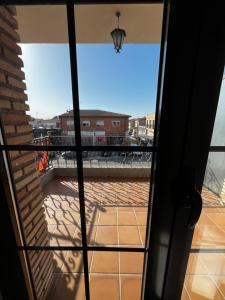 a view from the door of a balcony at Hostal Castilla in Mocejón +28 photos