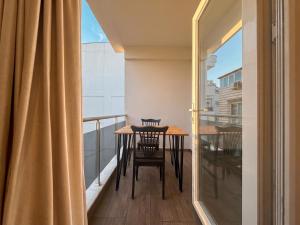 a balcony with a table and chairs and a window at Köşk Boutique Hotel - Old Town & City Center in Antalya