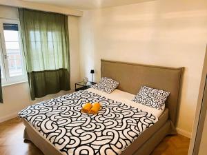 a bedroom with a bed with a pumpkin on it at 3 Room Old Town Flat - Munster in Zurich