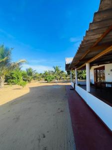 a building on the beach with a view of the sand at Moon Light Villa in Panama +7 photos