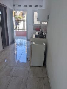 a kitchen with a counter and a refrigerator at Appartement VIDA 1 in Mahajanga