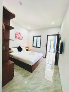 a bedroom with a large bed and a staircase at weolhouse in Hue +42 photos