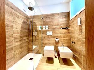 a bathroom with a sink and a shower at Hotel Berghof in Seefeld in Tirol +62 photos