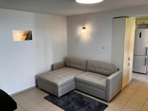 a living room with a couch in the corner at Chalupa Marie in Radimovice u Želcě