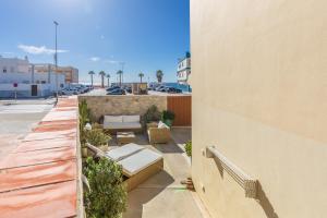 a view of a balcony with a couch on a building at Caracolas Luxury House in Tarifa