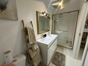 a bathroom with a sink and a shower and a toilet at Ar Doce in Portel +46 photos