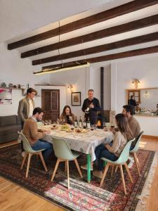 a group of people sitting around a table at Beautiful mountain chalet in Siete Aguas