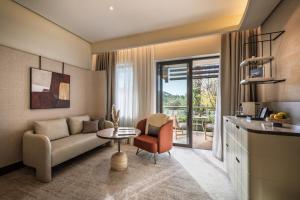 a living room with a couch and a table at Monte Mulini Adults Exclusive Hotel by Maistra Collection in Rovinj