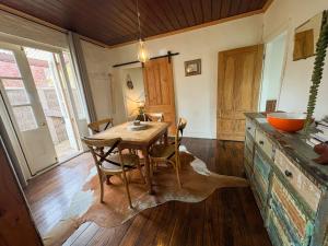 a dining room with a wooden table and chairs at Gladstone House in Beechworth +23 photos