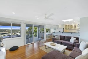 a living room with a couch and a table at Copa Dell - Stunning Views in Copacabana