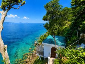 a house with a view of the ocean at The Cliff Bungalow in Koh Rong Sanloem