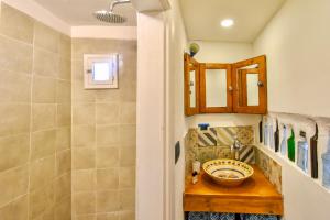a bathroom with a sink and a shower at Finisterre Casa di mare - Housea in Polignano a Mare