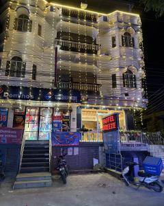 a store front of a building with lights at HOTEL BREEZE NEW JALPAIGURI in Siliguri