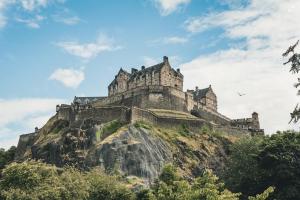 a castle on top of a mountain at The Wee Bothy at East Lothian Cottages in Lennoxlove