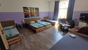 a living room with two beds and a couch at Ubytovaní U Dvora in Bohumín +36 photos