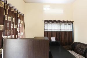 a podium in front of a window with a curtain at Hotel O Celebrity in Chandrapur