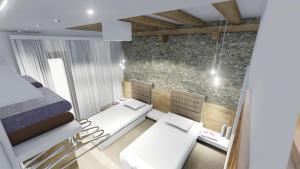 a room with two beds and two chairs in it at Pansion Vila Vrsar in Vrsar
